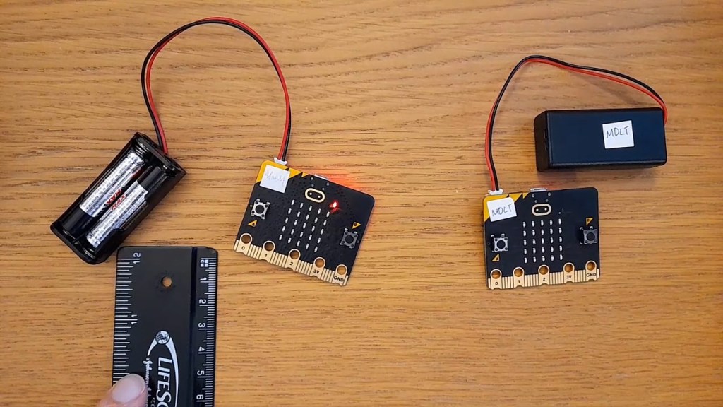 Picture of two micro:bits and a ruler.